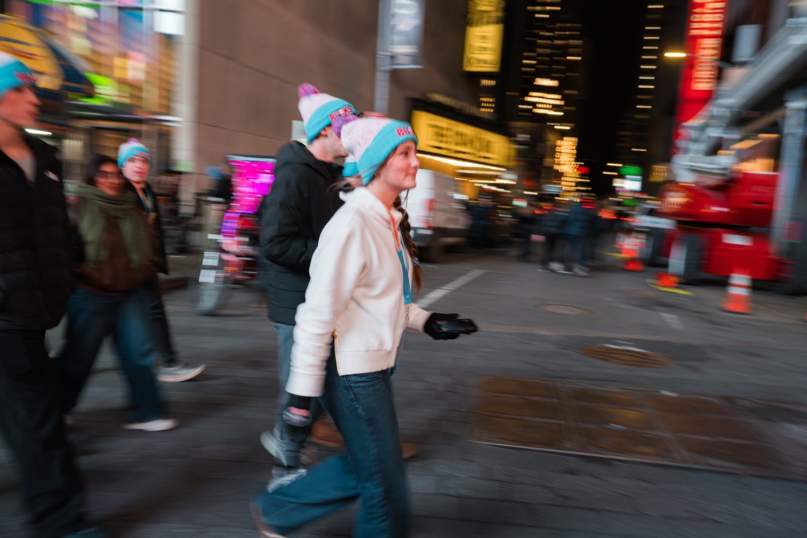 CTeen teens in Times Square at night under the billboards