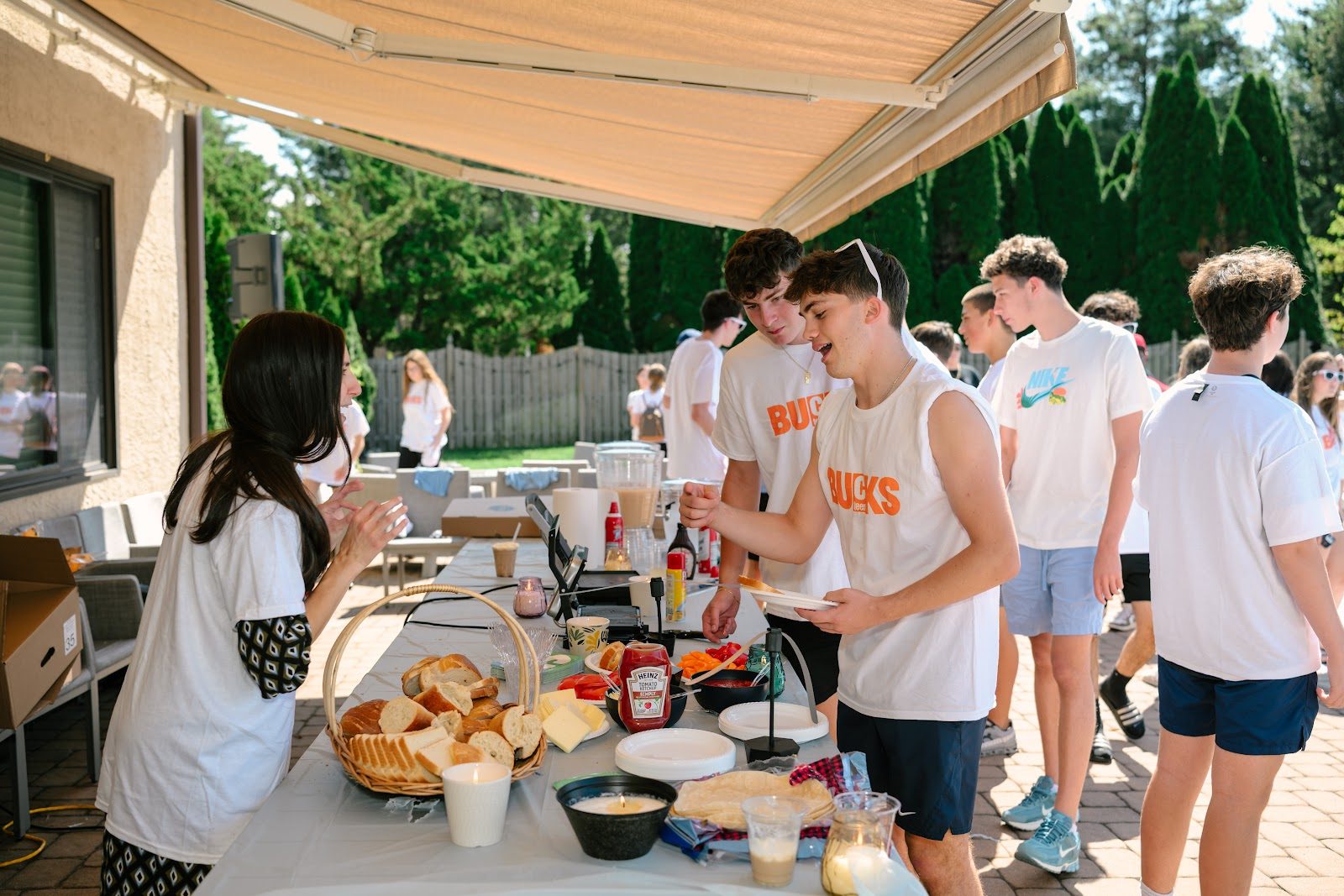 Teens playing games on the lawn at the CTeen Bucks kickoff
