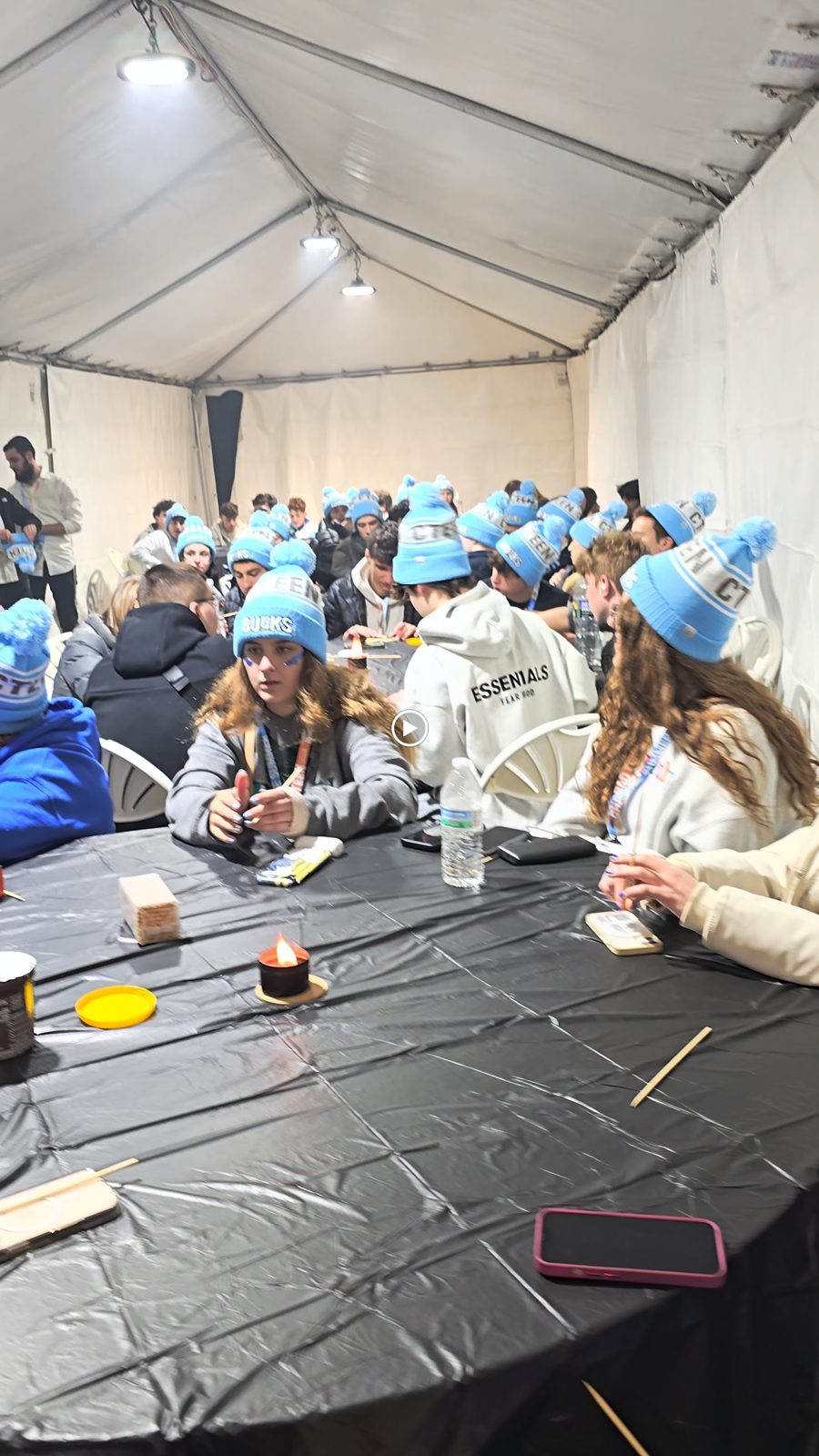 Candles lit on a cake shared with teens at the CTeen Bucks Shabbaton